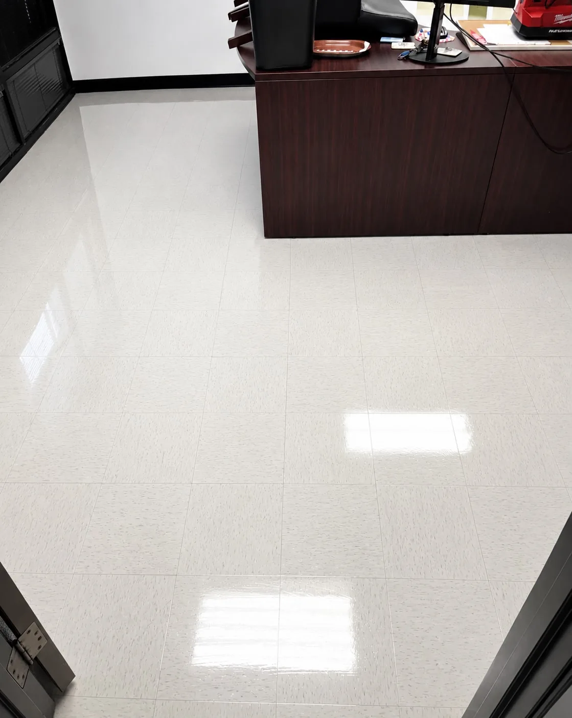 Office tile floor after cleaning, polished and shining