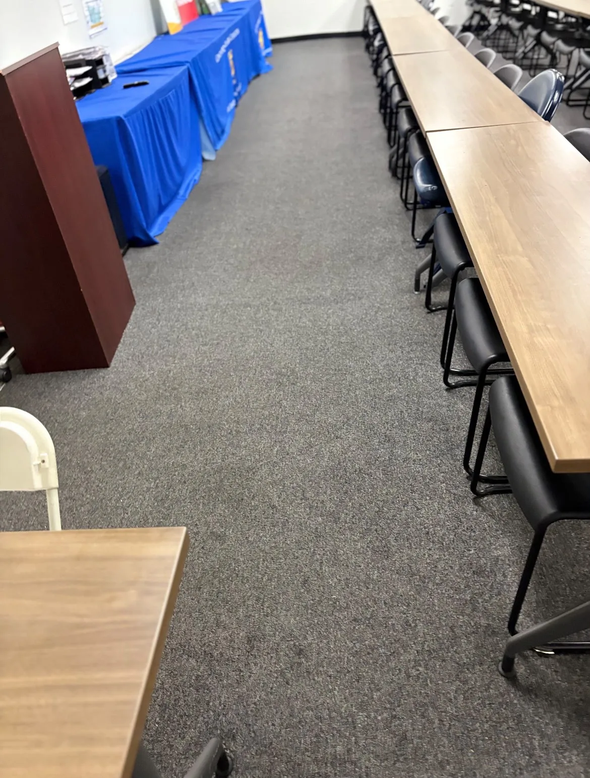 Training room carpet before cleaning, dull and dirty