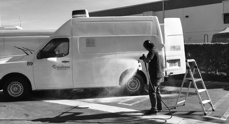Harbor crew washing a company fleet van