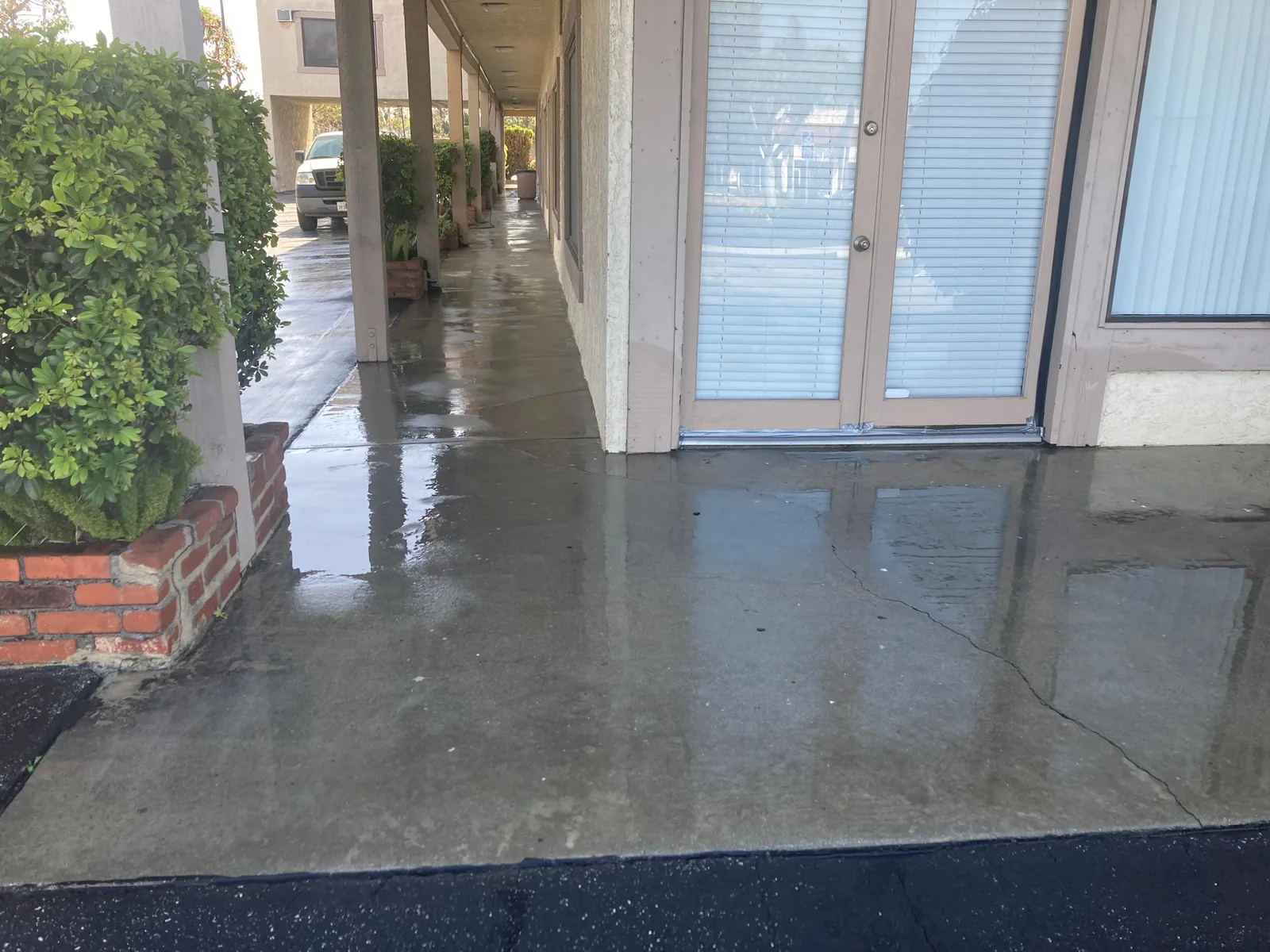 Power-washed walkway and entryway at a multi-unit building